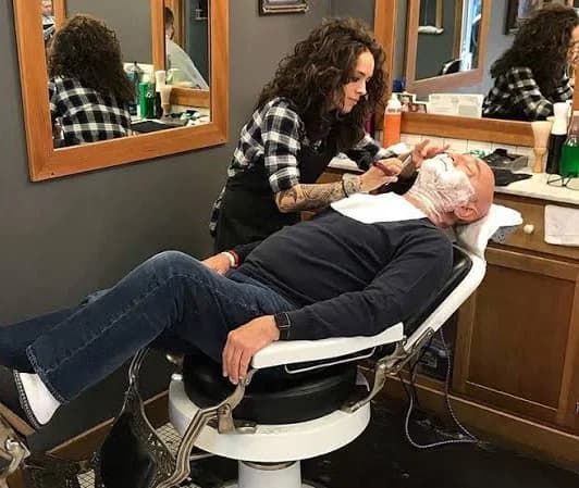 A hot-lather straight-razor shave in progress